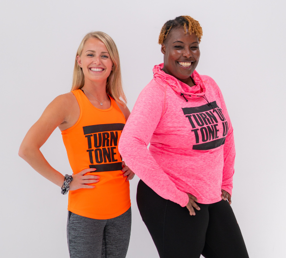 Two exercise instructors standing next to each other